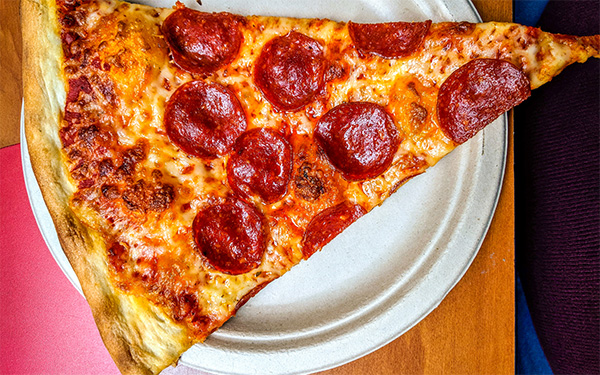 New York Pizza Slice on Disposable Plate