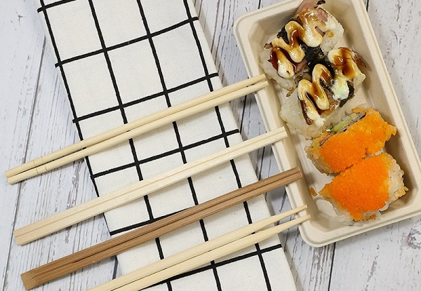 Enjoy sushi with disposable chopsticks and square bagasse plates.