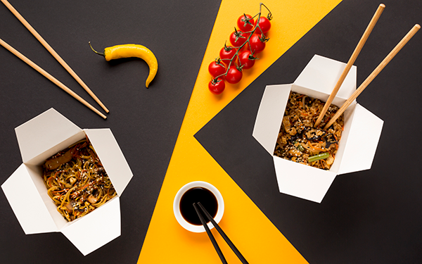 Chinese takeout with chopstics
