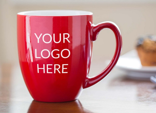Custom logo engraved red coffee mug on table