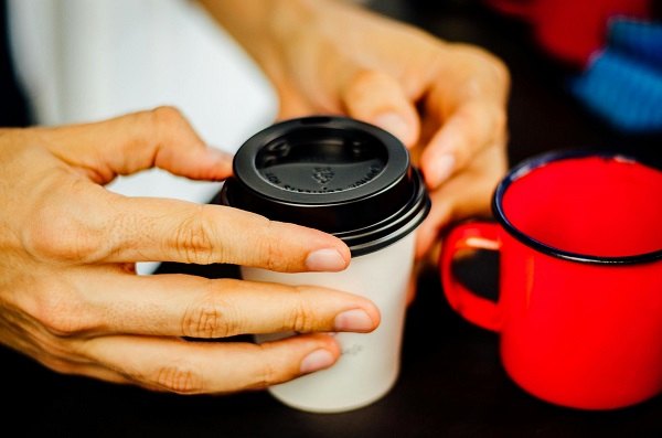A man is packing coffee.