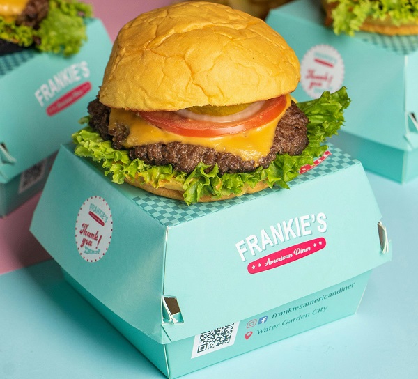 Branded burger packaging with printed logo, message and QR code.