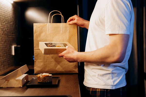 Consumers open takeout packaging.jpg