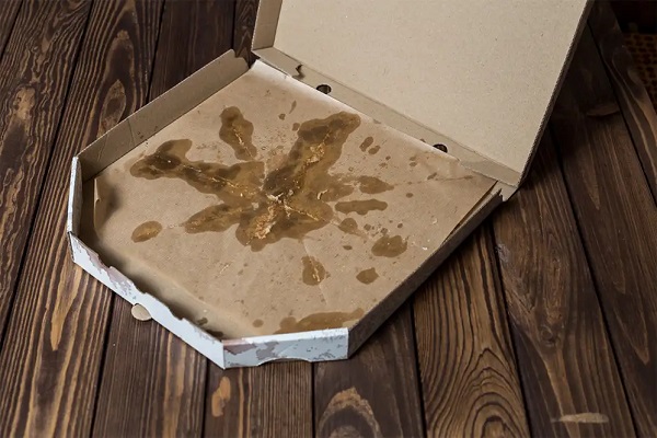 Paper pizza boxes with grease make recycling difficult.
