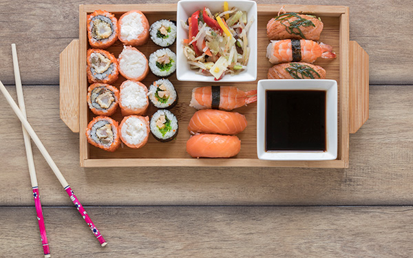 Wooden sushi tray on table