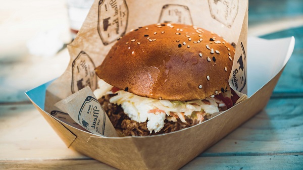 Fresh hamburger on paper food boat