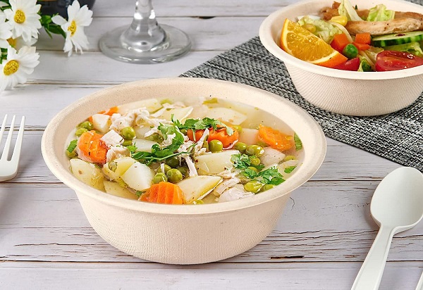 Biodegradable bagasse bowls are leak proof to withstand soup.