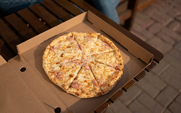 Pizza in Square box on a table