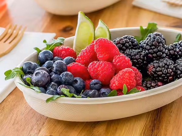 Sustainable oval food containers for fruit at parties.