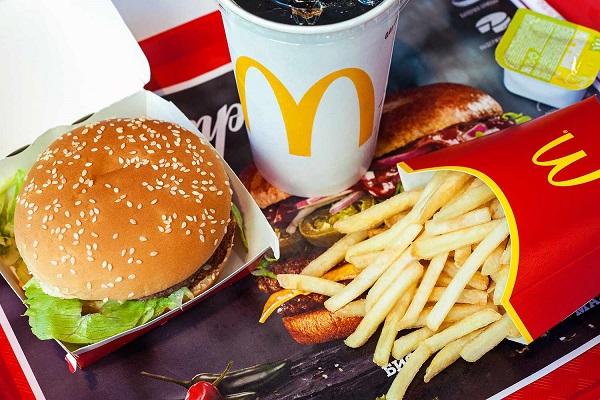 McDonalds fast food, using paper hamburger boxes, compostable disposable Coke cups for packaging.
